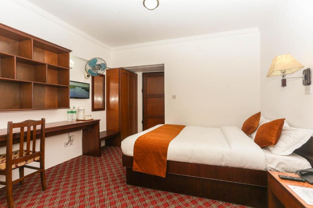 Postel nebo postele na pokoji v ubytování Fuji Hotel