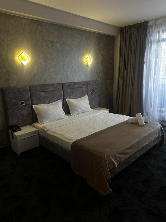 Postel nebo postele na pokoji v ubytování Black Tulip Hotel