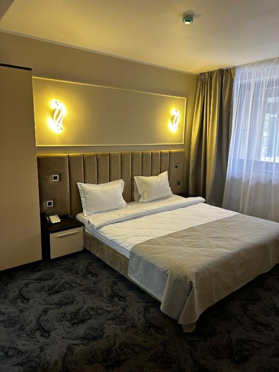 Postel nebo postele na pokoji v ubytování Black Tulip Hotel