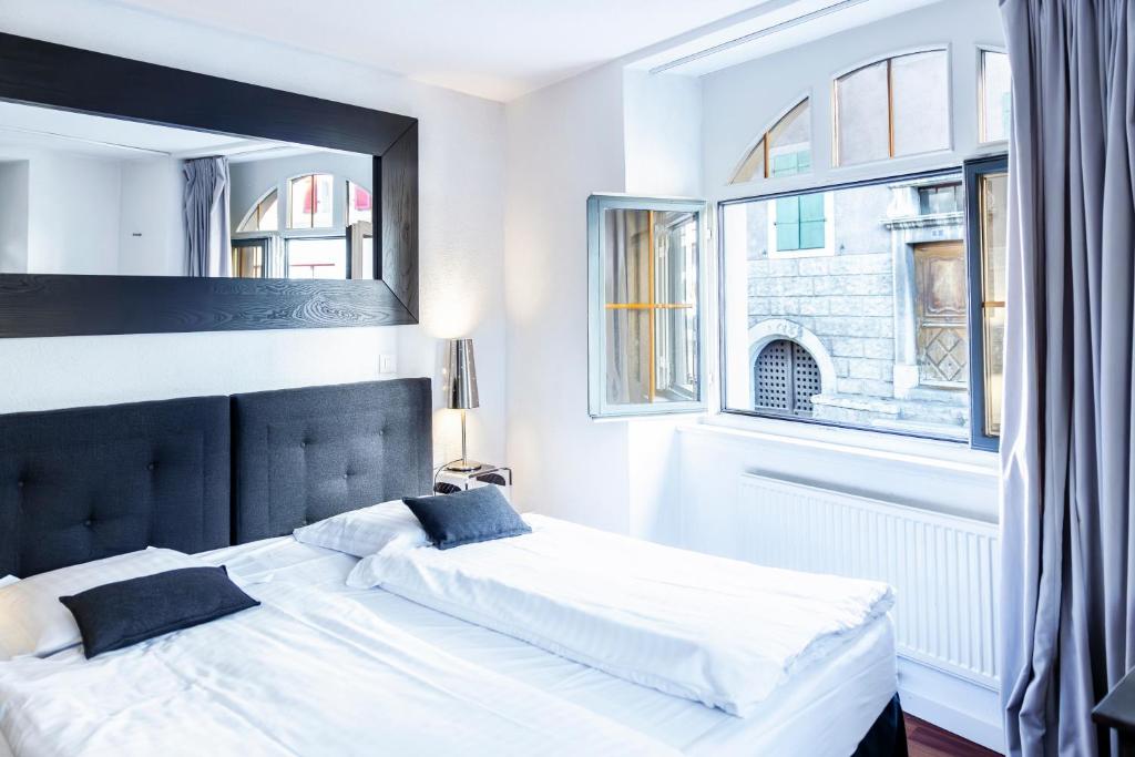 Uma cama ou camas num quarto em Tralala Hotel Montreux