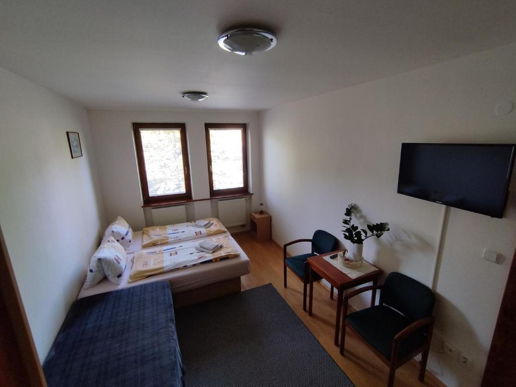 A bed or beds in a room at Privát Viktória Terchová