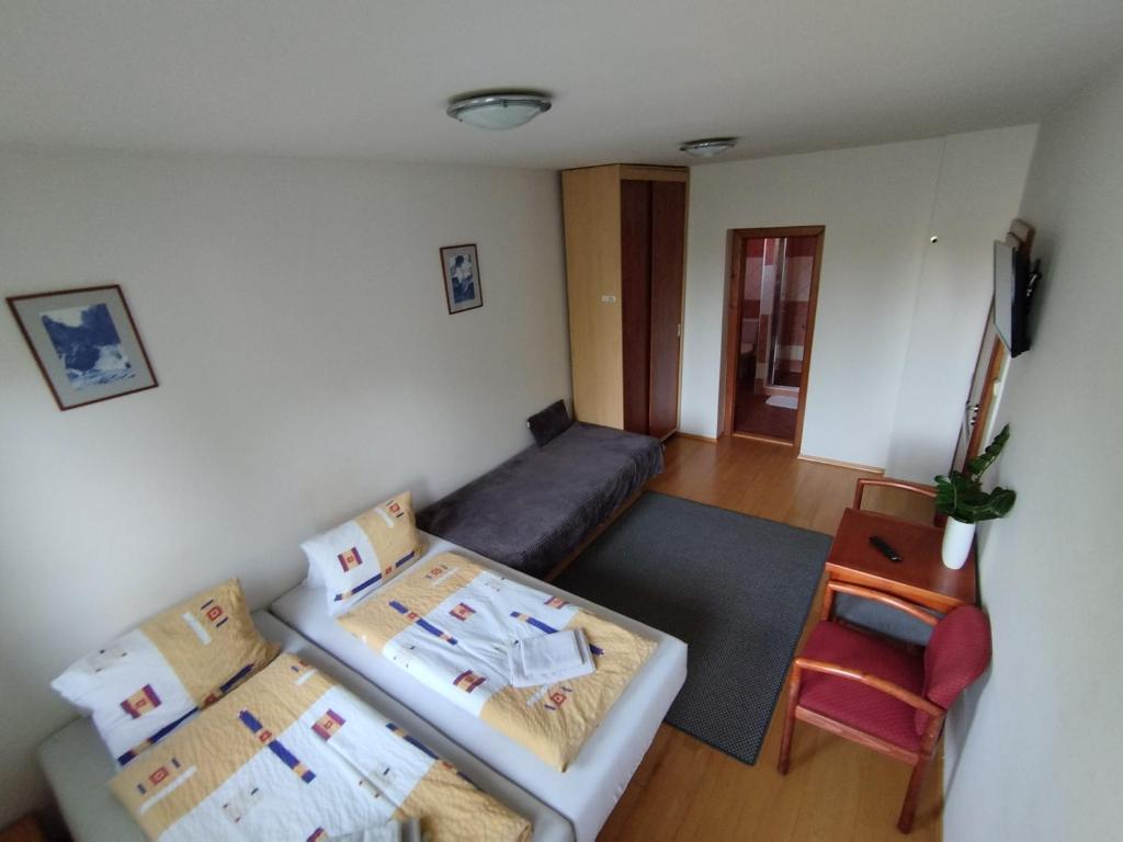 A bed or beds in a room at Privát Viktória Terchová
