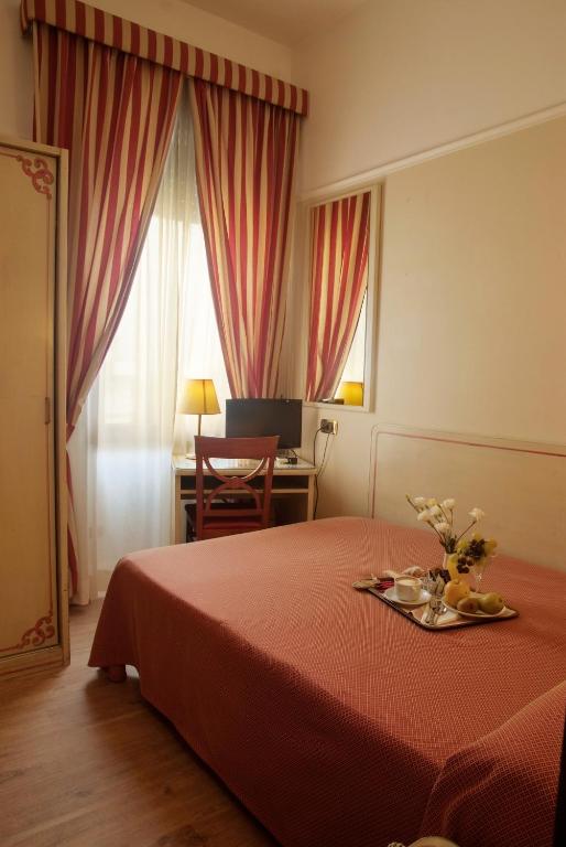Postel nebo postele na pokoji v ubytování Hotel Villa Rosa