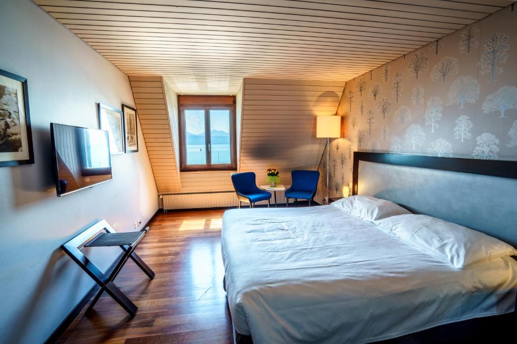 Postel nebo postele na pokoji v ubytování Rivage Hotel Restaurant Lutry