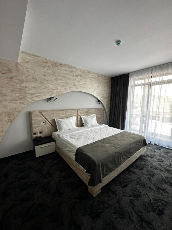 Postel nebo postele na pokoji v ubytování Black Tulip Hotel
