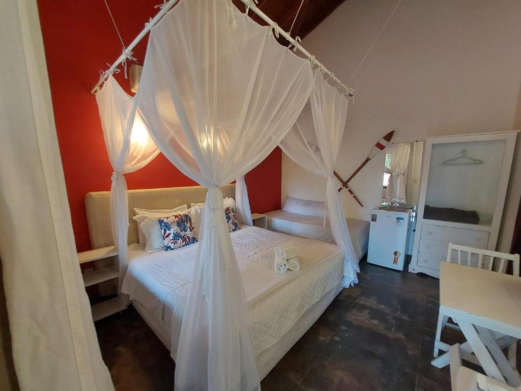 Postel nebo postele na pokoji v ubytování Magias de Paraty Ecopousada