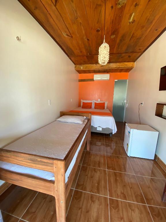 Postel nebo postele na pokoji v ubytování Chalé dos Ventos