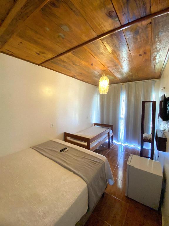 Postel nebo postele na pokoji v ubytování Chalé dos Ventos