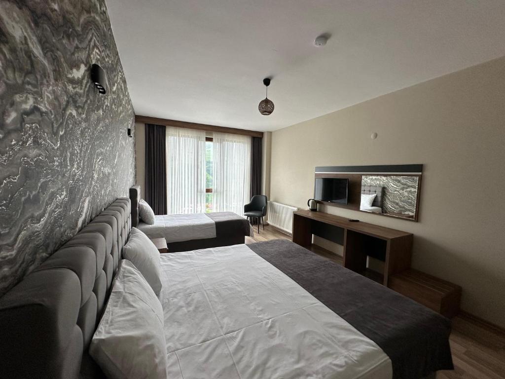 Кровать или кровати в номере Alya Teras Otel