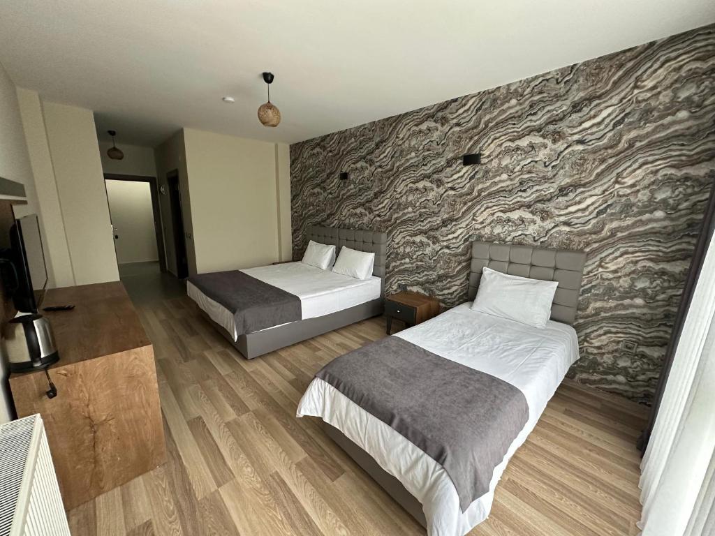 Кровать или кровати в номере Alya Teras Otel