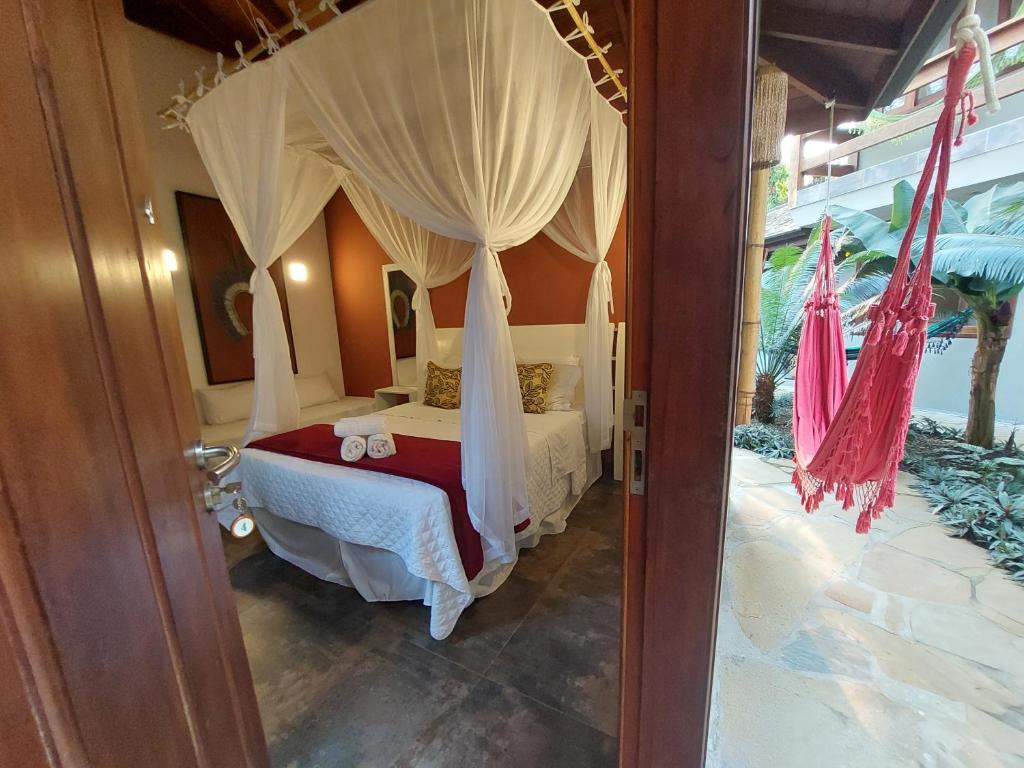 Postel nebo postele na pokoji v ubytování Magias de Paraty Ecopousada