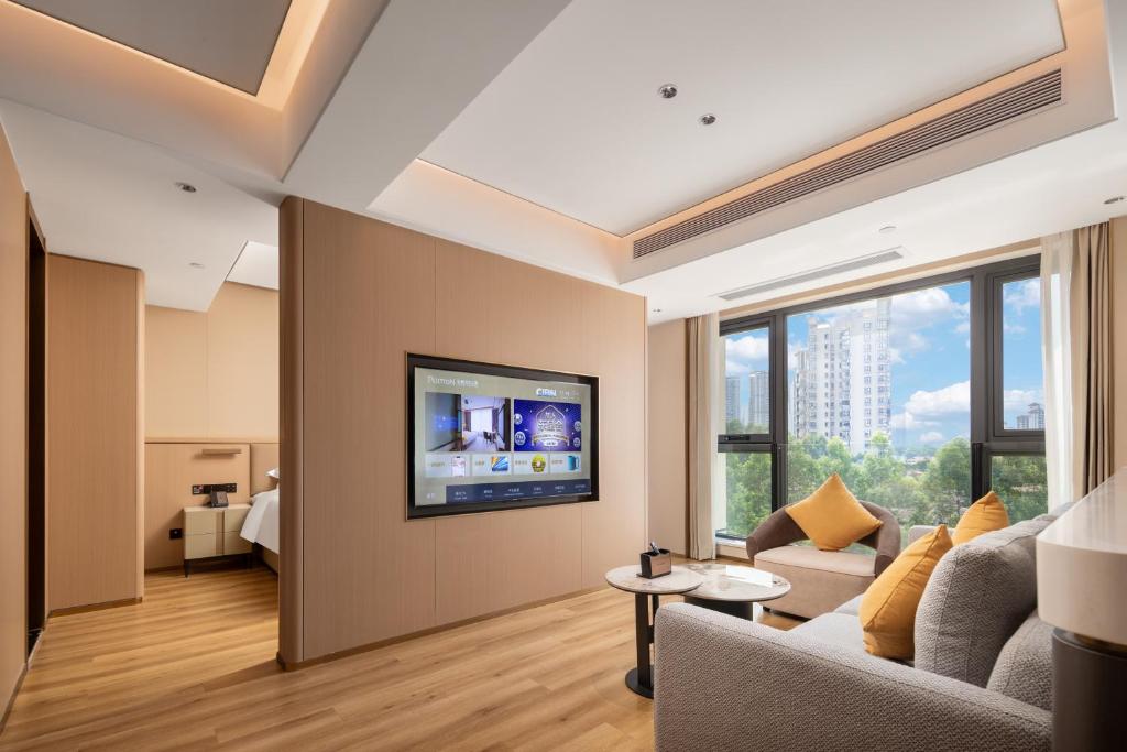 TV a/nebo společenská místnost v ubytování Jiangmen Poltton Executive Service Apartment