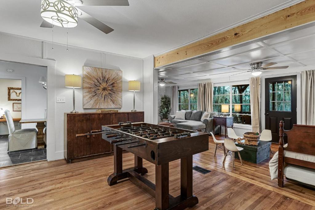 a living room with a ping pong table at Grand Harbor, Lakefront, With Kayaks & Canoes in Karnack
