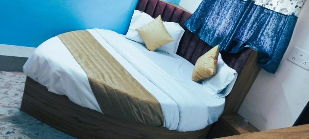 Postel nebo postele na pokoji v ubytování Hotel Sunrise Rooms