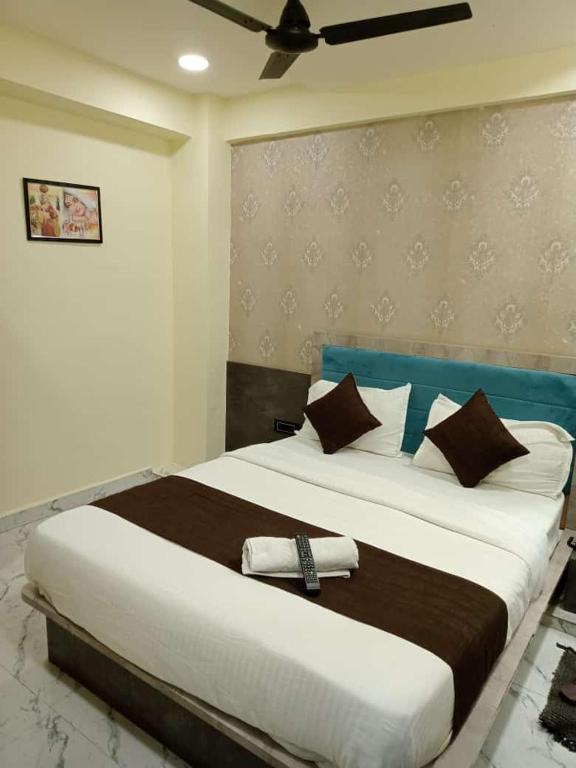 Postel nebo postele na pokoji v ubytování Hotel Sunrise Rooms