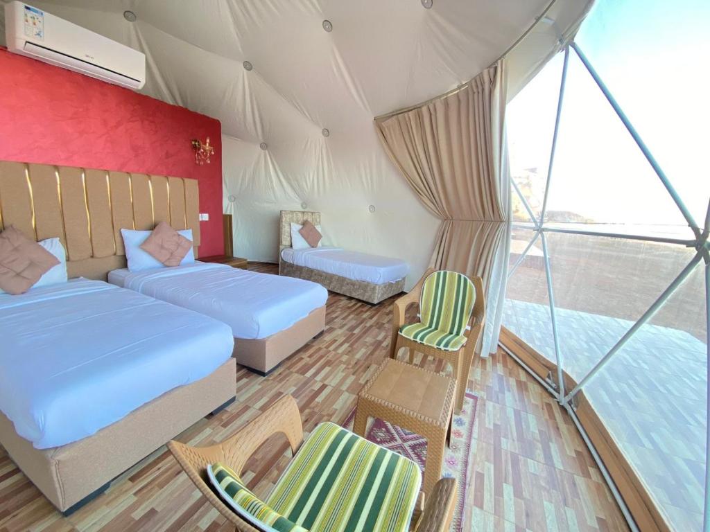 Voodi või voodid majutusasutuse Lulua luxury camp toas