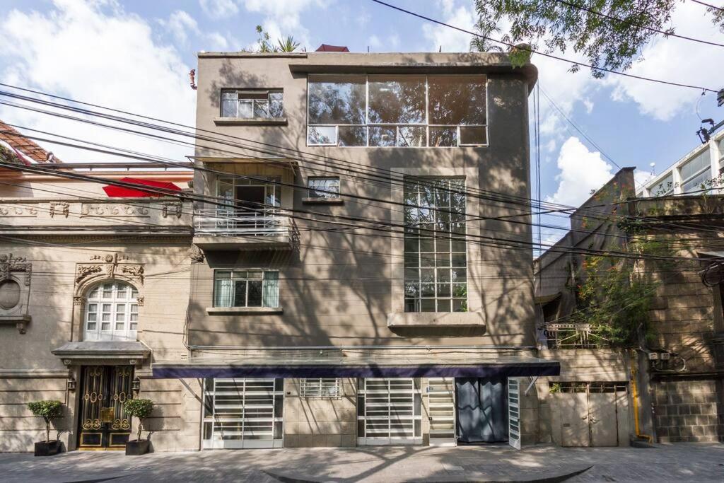 an old building with a lot of windows at Deco House with Park View Rooftop in Mexico City
