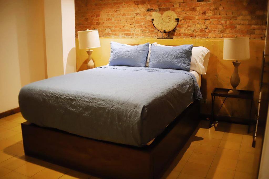 Postel nebo postele na pokoji v ubytování Oasis Hotel