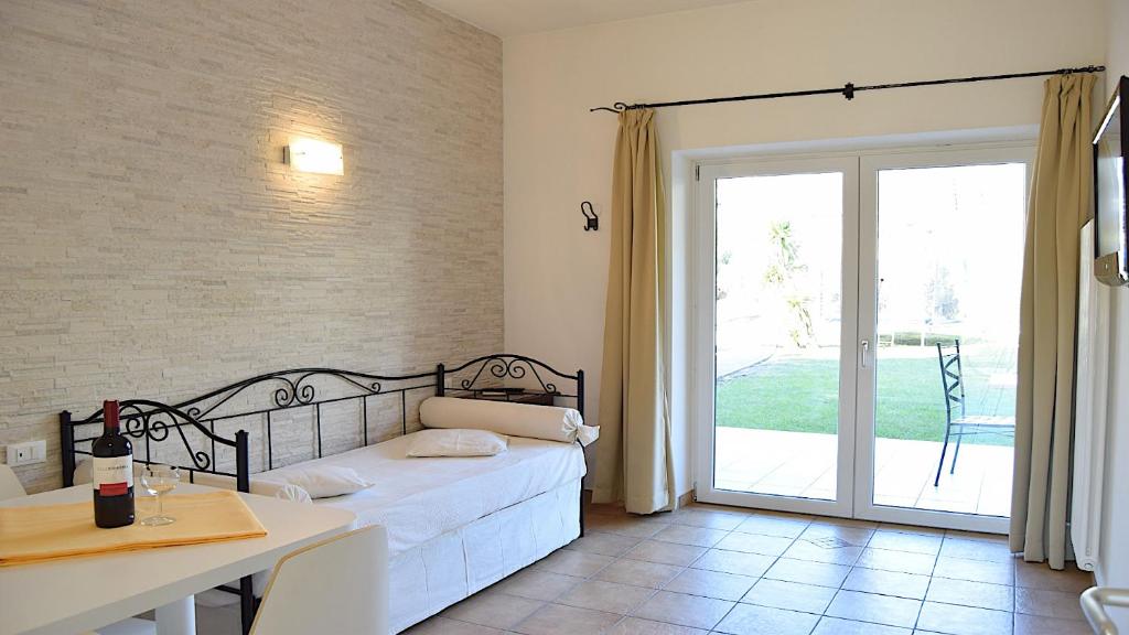 Posteľ alebo postele v izbe v ubytovaní Residenza Le Due Torri