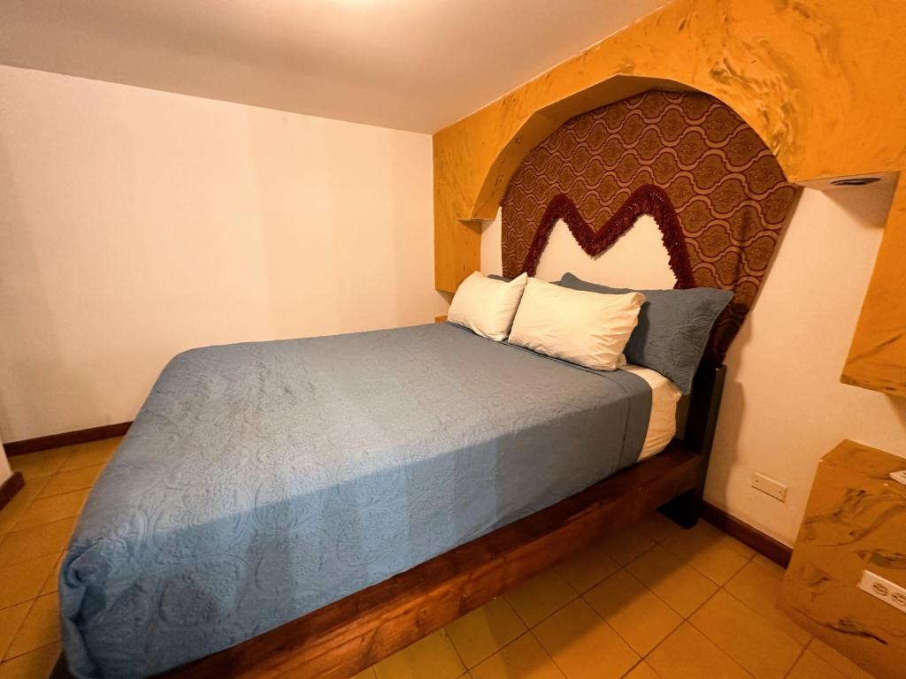 Postel nebo postele na pokoji v ubytování Oasis Hotel