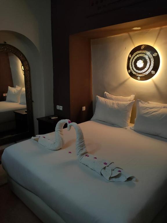 Postel nebo postele na pokoji v ubytování Riad shéhérazade Marrakech