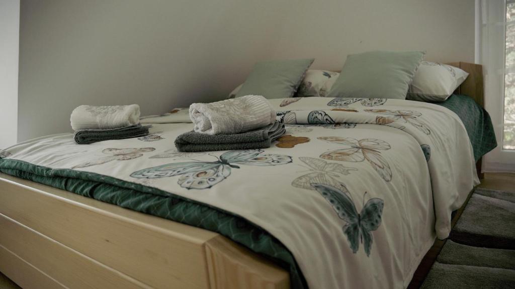 Postel nebo postele na pokoji v ubytování Sova apartman 2