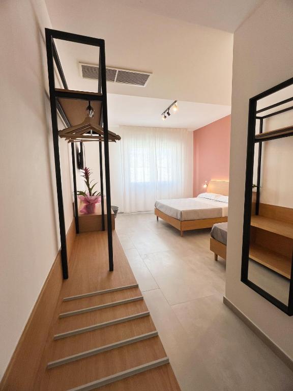 a room with a staircase leading to a bedroom at Le Camere Del Centro in Matera