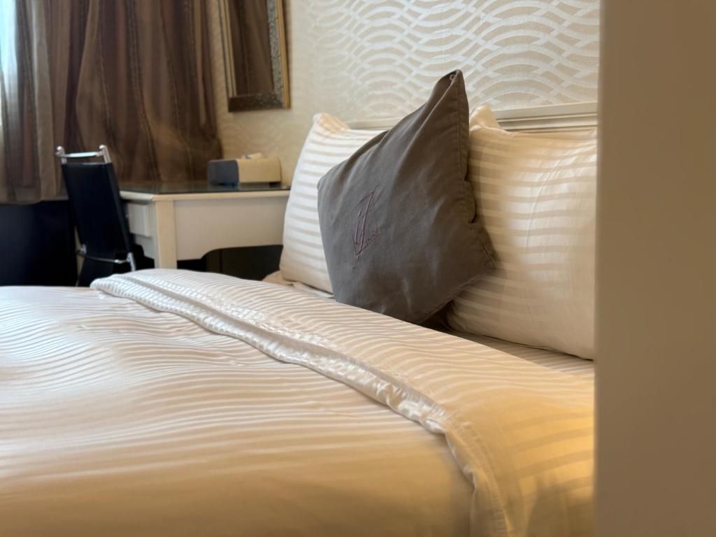 Postel nebo postele na pokoji v ubytování 意芙旅店 Ifinn Hotel