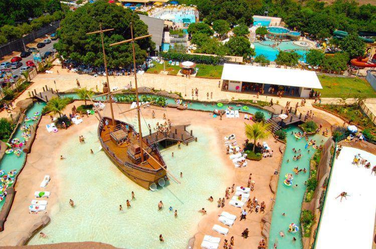 a water park with a boat in the water at Piazza diRoma com acesso ao Acqua Park e Splash - Temporada CN Adriele in Caldas Novas