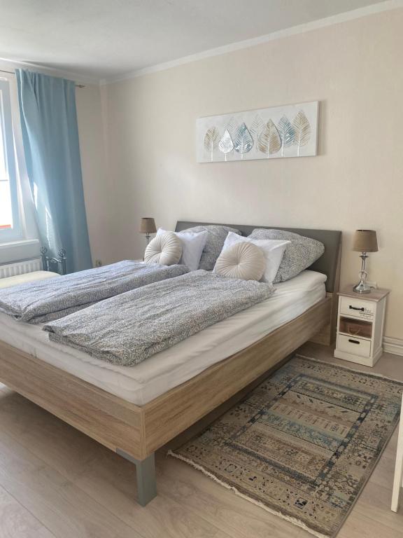 Postel nebo postele na pokoji v ubytování ULMA Residenz Peine