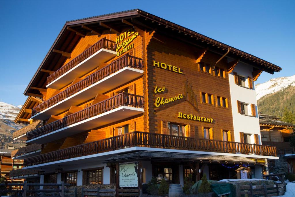 a hotel with balconies on the side of a building at Hotel Les Chamois in Verbier