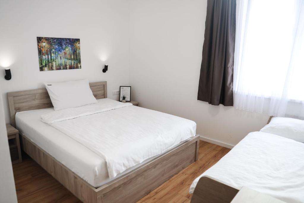 Postel nebo postele na pokoji v ubytování S Apart Rooms