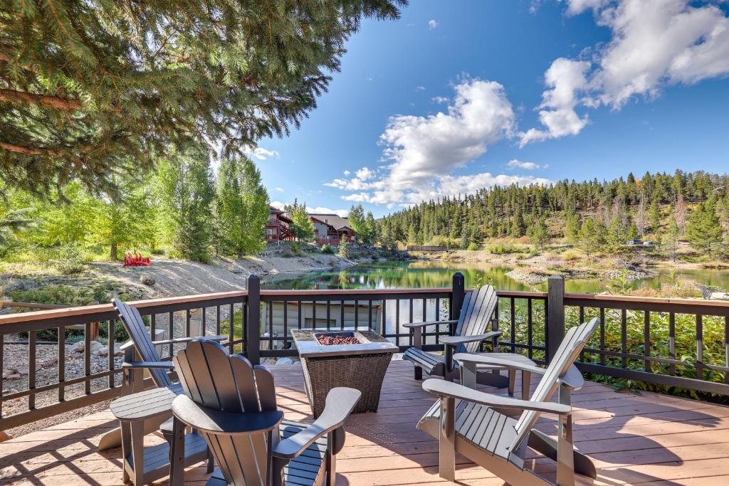 a deck with chairs and a table and a lake at 4 Mi to Ski Resort Pet-Friendly Breck Cabin in Breckenridge