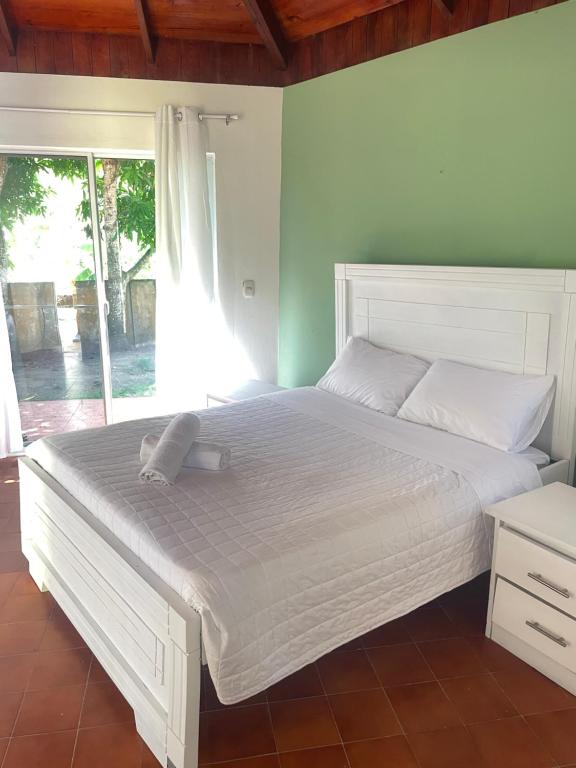 Postel nebo postele na pokoji v ubytování Palms Lounge Cabarete