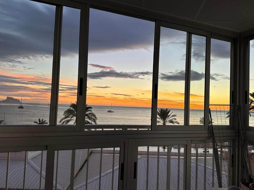 a view of the ocean from the balcony of a house at Alquiler in Albir