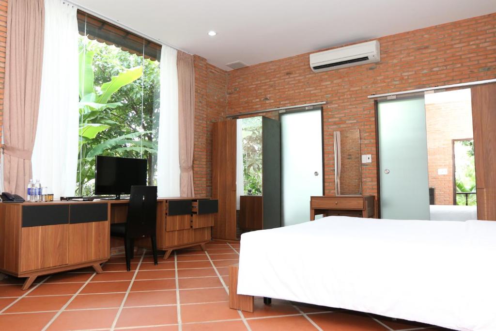 TV a/nebo společenská místnost v ubytování Mekong Long Thanh Resort & Reststop