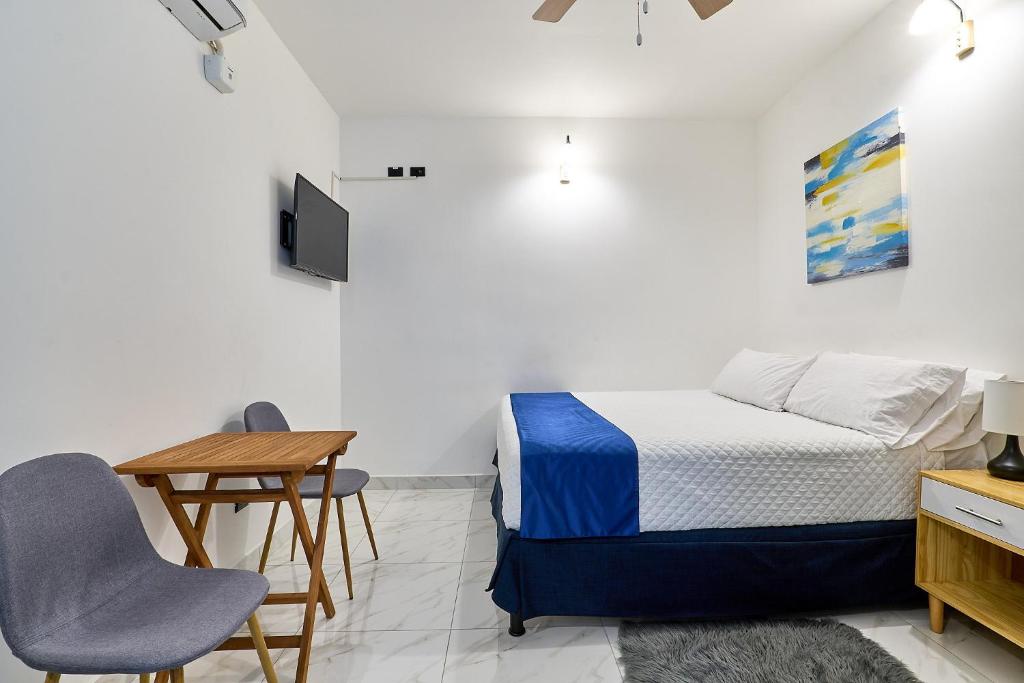 Postel nebo postele na pokoji v ubytování Apartaestudios La capital