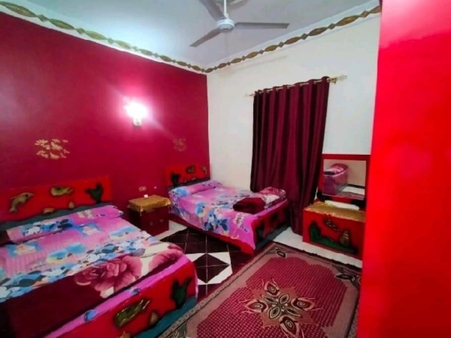 Postel nebo postele na pokoji v ubytování Nubian Paradise - Easy Check in 24 hr