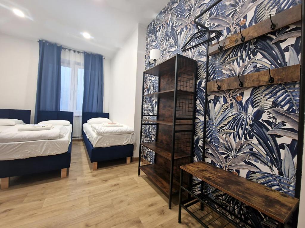 Postel nebo postele na pokoji v ubytování Apart HoStel Helvetia B&B