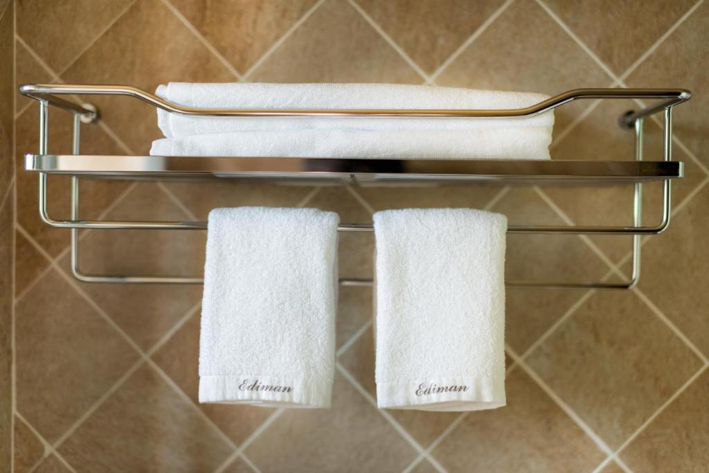 two towels on a towel rack in a bathroom at Ediman Bed &amp; Breakfast in Hualien City