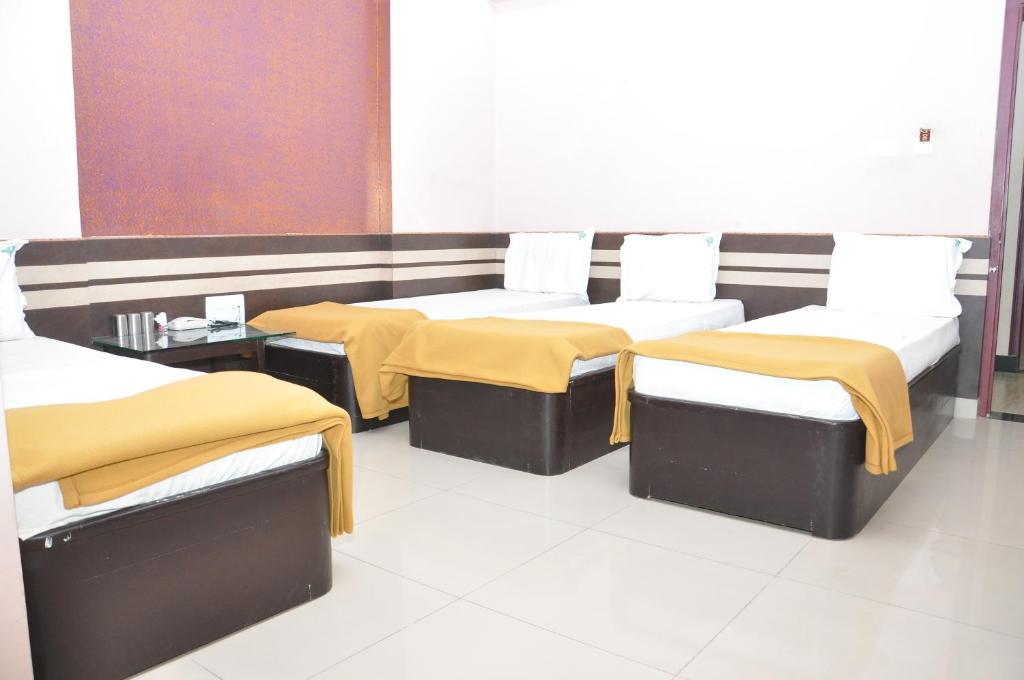 Postel nebo postele na pokoji v ubytování SSR Hotel