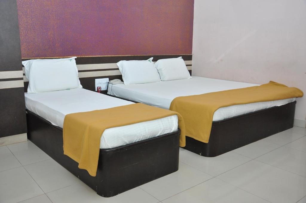 Postel nebo postele na pokoji v ubytování SSR Hotel