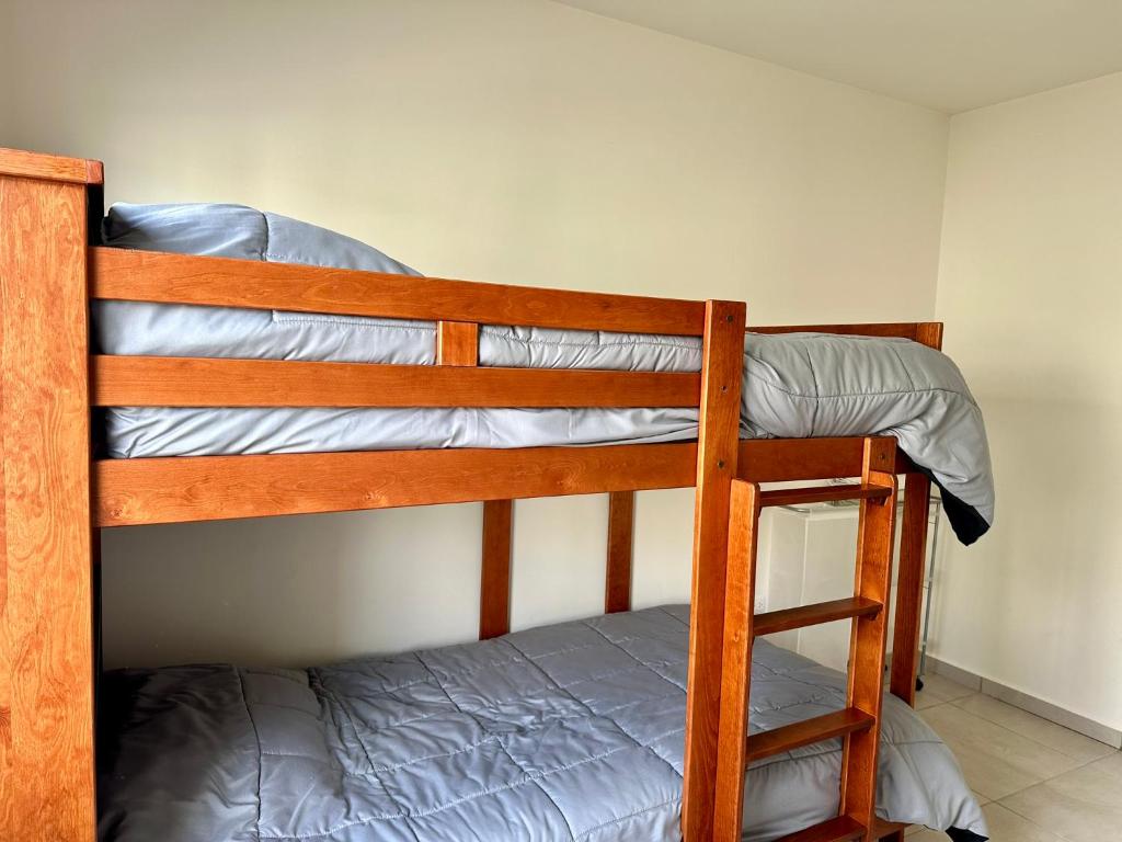 a bunk bed with a ladder on the bottom bunk at Private Room Bunk Bed Queretaro Entrance in Miranda