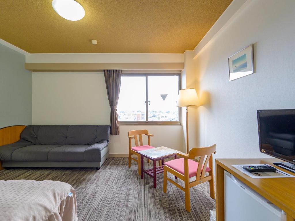 TV a/nebo společenská místnost v ubytování Hisai Green Hotel