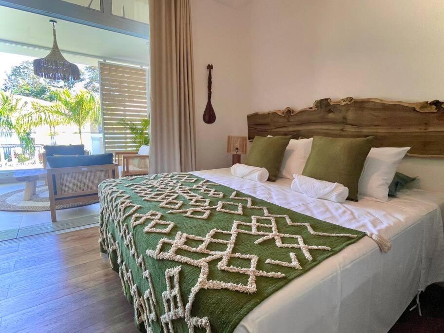 Postel nebo postele na pokoji v ubytování Te Miti - Tropical paradise retreat