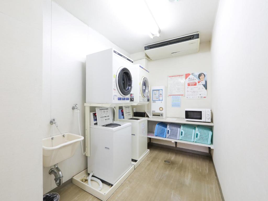 Kuchyň nebo kuchyňský kout v ubytování Hisai Green Hotel