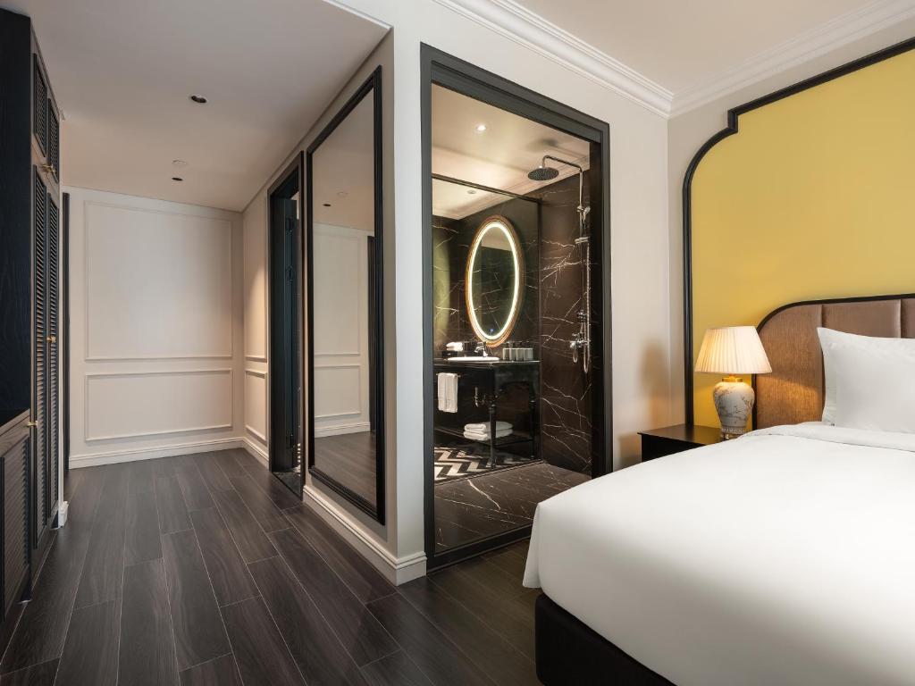 Postel nebo postele na pokoji v ubytování T Boutique Hotel