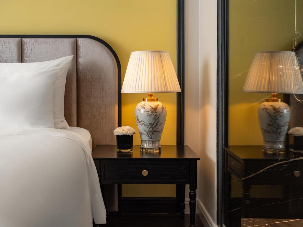 Postel nebo postele na pokoji v ubytování T Boutique Hotel