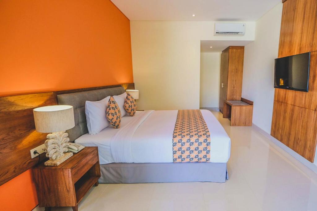Postel nebo postele na pokoji v ubytování Kahayana Suites Ubud