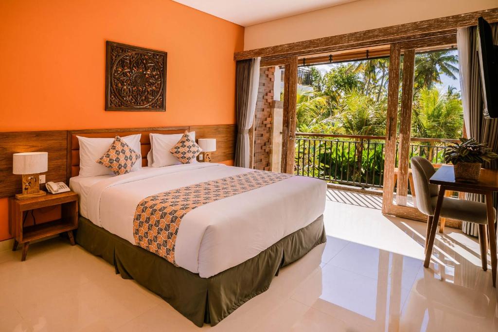 Postel nebo postele na pokoji v ubytování Kahayana Suites Ubud